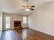 Spacious living room with hardwood floors, fireplace, and vaulted ceiling at 1624 Graystone Dr, Hampton, GA 30228