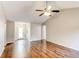 Living room with hardwood floors and access to entryway at 1624 Graystone Dr, Hampton, GA 30228