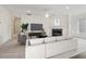 Living room with fireplace, large windows, and hardwood floors at 615 Grassmeade Ln, Woodstock, GA 30188