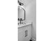 Small bathroom with white vanity and black accents at 3290 Ethan Dr, Marietta, GA 30062