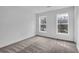 Well-lit bedroom with gray carpeting and two large windows at 3290 Ethan Dr, Marietta, GA 30062