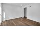 Well-lit bedroom featuring hardwood floors and an open door at 3290 Ethan Dr, Marietta, GA 30062