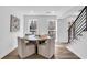 Bright dining area with a round table, seating for four, and natural light from large windows at 3290 Ethan Dr, Marietta, GA 30062