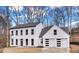 Stunning two-story home with a modern design, a black roof and a two car garage at 3290 Ethan Dr, Marietta, GA 30062