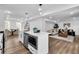 Modern kitchen with white cabinets, stainless appliances, and a view into the dining and living rooms at 3290 Ethan Dr, Marietta, GA 30062