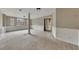Finished basement with neutral carpet, bright lighting, and multiple windows and access to a bathroom at 336 Adelene Way, Dallas, GA 30157