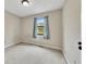 Standard bedroom with neutral walls and carpet, window with curtains, and overhead lighting at 336 Adelene Way, Dallas, GA 30157