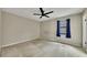 Spacious bedroom with a ceiling fan and a window allowing natural light at 336 Adelene Way, Dallas, GA 30157