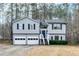 Split level home with a 2-car garage and a staircase leading to the front door at 336 Adelene Way, Dallas, GA 30157