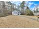 Well-maintained front exterior with a long driveway and attached garage at 336 Adelene Way, Dallas, GA 30157