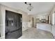 Eat-in kitchen featuring a black refrigerator, white cabinets, and neutral walls at 336 Adelene Way, Dallas, GA 30157