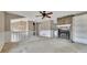 Living room featuring fireplace with stone accent wall and ceiling fan at 336 Adelene Way, Dallas, GA 30157