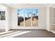 Sunlit living room with large windows and white walls at 494 Michael Dr, Alpharetta, GA 30009