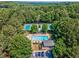Overhead image showing the community pool, clubhouse, tennis courts, parking, and landscape at 1506 Brookridge Dr, Woodstock, GA 30189