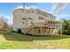 Expansive backyard view featuring a two-story deck and screened porch of this beautiful home at 1506 Brookridge Dr, Woodstock, GA 30189