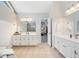 Open bathroom with and vanities, granite countertops, and modern finishes at 1506 Brookridge Dr, Woodstock, GA 30189