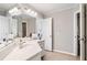 Bathroom featuring a large mirror, double sinks, and modern fixtures at 1506 Brookridge Dr, Woodstock, GA 30189