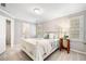 Comfortable bedroom with neutral walls and carpet featuring a full bed and bedside table with lamp at 1506 Brookridge Dr, Woodstock, GA 30189