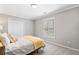 Cozy bedroom with neutral colors, shuttered windows and plush carpet, creating a tranquil retreat for rest and relaxation at 1506 Brookridge Dr, Woodstock, GA 30189