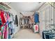 Walk-in closet features ample storage, shelving, and natural lighting at 1506 Brookridge Dr, Woodstock, GA 30189