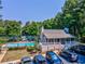 Exterior view of the clubhouse, pool, parking and surrounding trees at 1506 Brookridge Dr, Woodstock, GA 30189