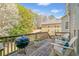 Outdoor deck with barbecue grill and seating, perfect for entertaining and enjoying the backyard view at 1506 Brookridge Dr, Woodstock, GA 30189