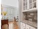 Dining area with hardwood floors, shuttered windows and stylish cabinetry and counter space, adding an elegant touch to the home at 1506 Brookridge Dr, Woodstock, GA 30189