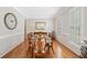 Formal dining room featuring hardwood floors, wainscoting, and space for eight at 1506 Brookridge Dr, Woodstock, GA 30189