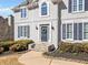 Inviting home entrance with stone steps, a wreath on the front door, and manicured landscaping at 1506 Brookridge Dr, Woodstock, GA 30189