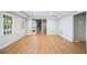 Open living room with wood floors and neutral decor at 1506 Brookridge Dr, Woodstock, GA 30189
