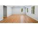 Spacious living room boasts hardwood floors, recessed lighting, and natural lighting at 1506 Brookridge Dr, Woodstock, GA 30189