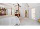 Neutral main bedroom featuring a four poster bed and glimpses of the en-suite bathroom at 1506 Brookridge Dr, Woodstock, GA 30189