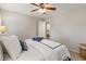 Well lit bedroom with queen bed and access to another bedroom at 9735 Hillside Dr, Roswell, GA 30076