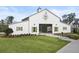 A stylish barn with green shutters and landscaping with ample parking, adding rustic charm to the property at 646 Brashy St, Woodstock, GA 30188