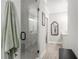 Spa-like bathroom with a large walk-in shower and marble tile at 646 Brashy St, Woodstock, GA 30188