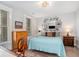 Calm bedroom boasting a bed, mirror, natural light, and desk at 646 Brashy St, Woodstock, GA 30188