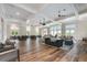 Spacious common area with modern furnishings, ample seating, and abundant natural light, ideal for gatherings at 646 Brashy St, Woodstock, GA 30188