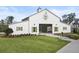 White community barn with green accents and landscaping at 646 Brashy St, Woodstock, GA 30188