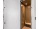 Residential elevator with wood-paneled interior and a built-in seat at 646 Brashy St, Woodstock, GA 30188
