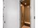 Small, private elevator with wood paneling and bench at 646 Brashy St, Woodstock, GA 30188