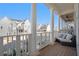Relaxing covered porch with seating area, overlooking charming neighborhood at 646 Brashy St, Woodstock, GA 30188