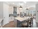 Modern kitchen with white cabinets, quartz countertops, and stainless steel appliances at 646 Brashy St, Woodstock, GA 30188