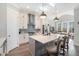 Modern kitchen featuring white cabinets, stainless steel appliances, and a gray island at 646 Brashy St, Woodstock, GA 30188