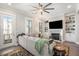 Cozy living room with a fireplace, built-in shelves, and comfortable seating at 646 Brashy St, Woodstock, GA 30188