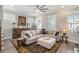 Living room with sectional sofa, area rug, and built-in shelving at 646 Brashy St, Woodstock, GA 30188