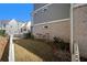 Landscaped side yard with a white picket fence at 646 Brashy St, Woodstock, GA 30188