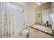 Neat bathroom with a shower-tub combo and granite vanity top at 2007 Woodside Park Dr, Woodstock, GA 30188