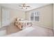 Bright bedroom with carpet, a ceiling fan, and natural light from the window at 2007 Woodside Park Dr, Woodstock, GA 30188