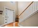 Bright foyer features hardwood floors, a staircase, and a welcoming entryway at 2007 Woodside Park Dr, Woodstock, GA 30188