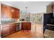 Well-equipped kitchen with stainless steel appliances, granite countertops, and modern cabinetry at 2007 Woodside Park Dr, Woodstock, GA 30188